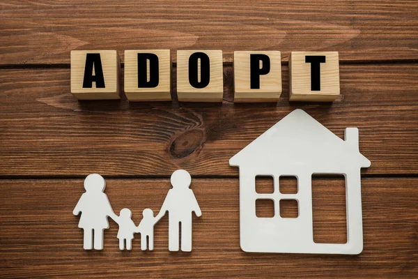 Family Figure House Word Adopt Made Cubes Wooden Table Flat — Stockfoto