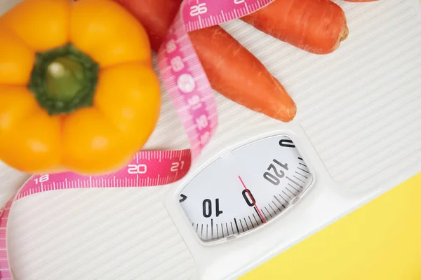 Scales Vegetables Measuring Tape Yellow Background Top View — Stockfoto