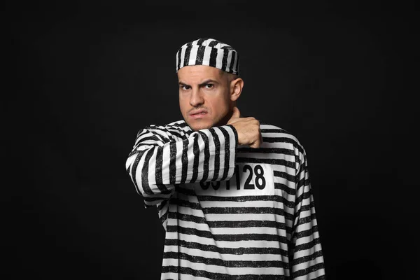 Prisoner Striped Uniform Showing Throat Cutting Gesture Black Background — Stockfoto