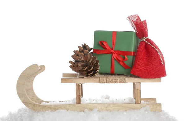 Wooden Sleigh Christmas Gifts Pine Cone Artificial Snow White Background — 图库照片