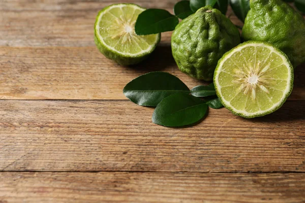 Fresh Ripe Bergamot Fruits Green Leaves Wooden Table Space Text — Stockfoto