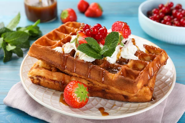 Delicious Belgian Waffles Berries Caramel Sauce Served Turquoise Wooden Table — Stock Photo, Image