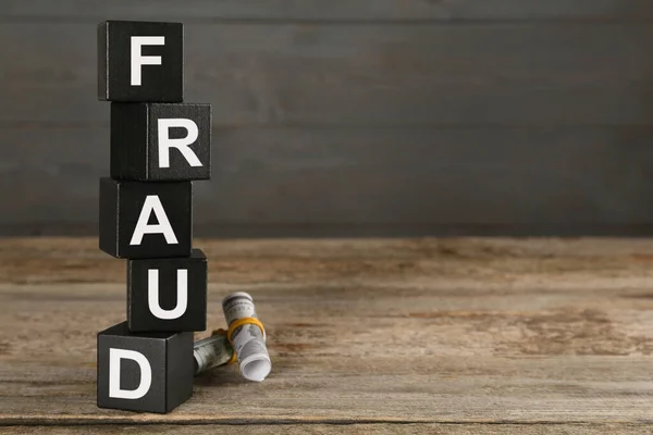 Black Cubes Word Fraud Money Wooden Table Space Text — Stock Photo, Image