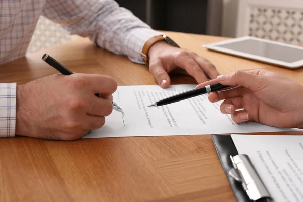 Businesspeople Signing Contract Wooden Table Indoors Closeup Hands — Fotografia de Stock