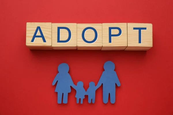 Family Figure Word Adopt Made Cubes Red Background Flat Lay — Stockfoto