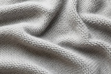 Arka plan olarak güzel gri örülmüş kumaş, üst görünüm