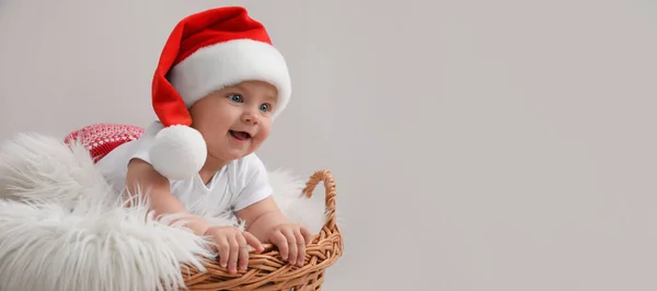 Cute Baby Wearing Santa Hat Wicker Basket Light Grey Background — Stockfoto