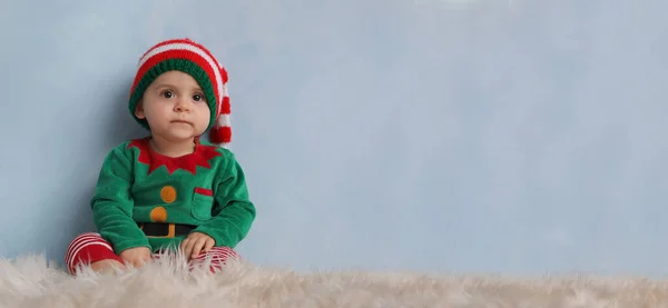 Cute Baby Wearing Elf Costume Fluffy Carpet Light Blue Wall — Stockfoto
