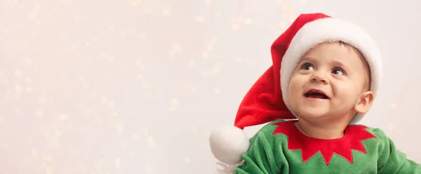 Schattige Baby Draagt Kerstkostuum Tegen Wazig Licht Ruimte Voor Tekst — Stockfoto