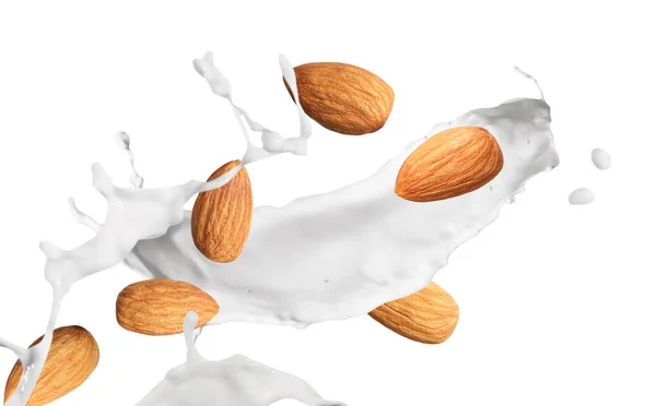白い背景においしいアーモンドミルクとナッツ — ストック写真