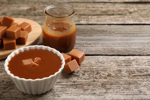 Tasty Salted Caramel Candies Wooden Table Space Text — Stockfoto