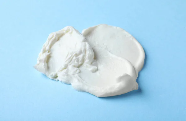 Smear Delicious Cream Cheese Light Blue Background — стоковое фото