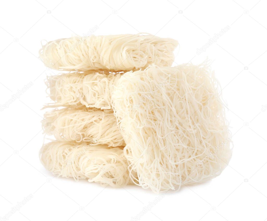 Bricks of dried rice noodles isolated on white. East Asian cuisine