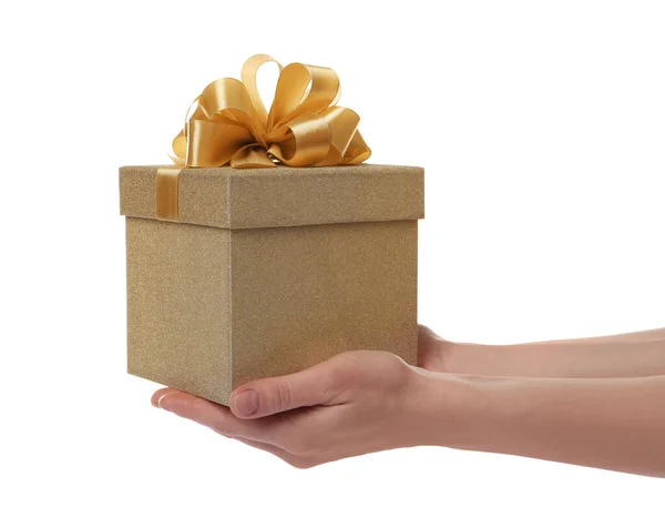 Woman Holding Golden Gift Box White Background Closeup — Zdjęcie stockowe