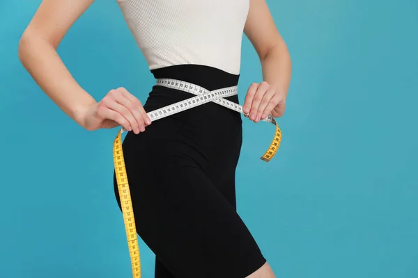 Woman Sportswear Measuring Waist Tape Light Blue Background Closeup Space — 图库照片