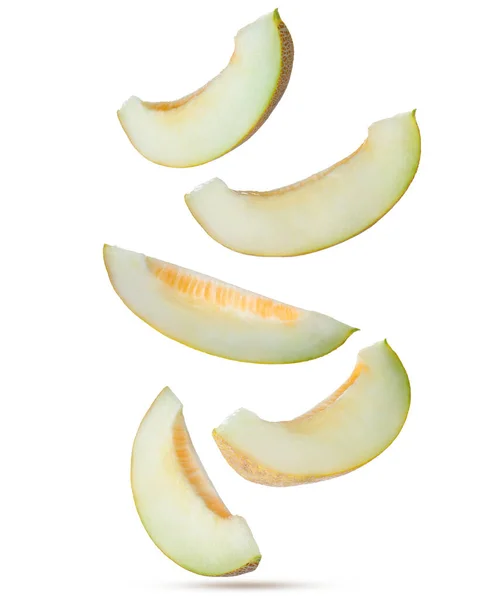 Pieces Delicious Ripe Melon Falling White Background — Stockfoto