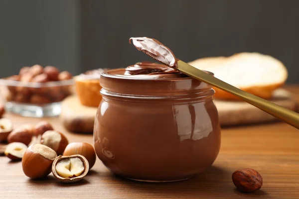 Glass Jar Tasty Chocolate Hazelnut Spread Nuts Wooden Table — 图库照片