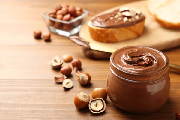 Glass Jar Tasty Chocolate Hazelnut Spread Nuts Wooden Table Space — 图库照片