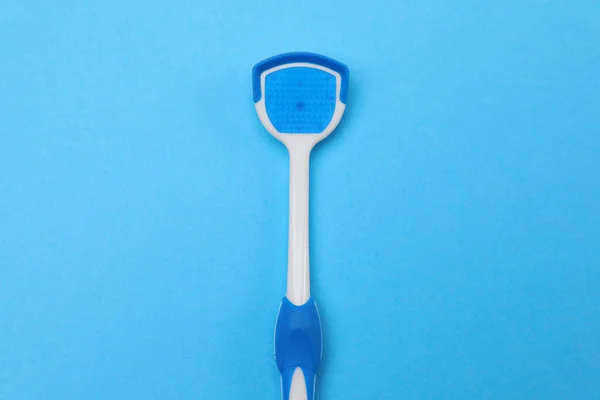 Tongue Cleaner Blue Background Top View — Stock Photo, Image