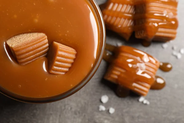 Tasty Salted Caramel Candies Glass Bowl Grey Table Top View — Photo
