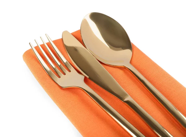 Orange Napkin Golden Cutlery White Background Closeup — Fotografie, imagine de stoc