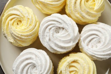 Many different delicious zephyrs on plate, top view