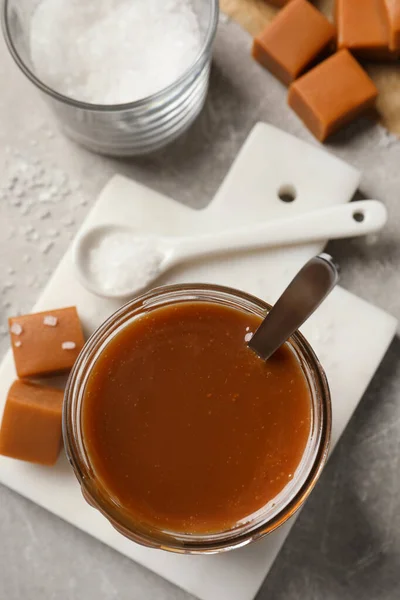 Tasty Salted Caramel Candies Light Grey Table Flat Lay — Stockfoto
