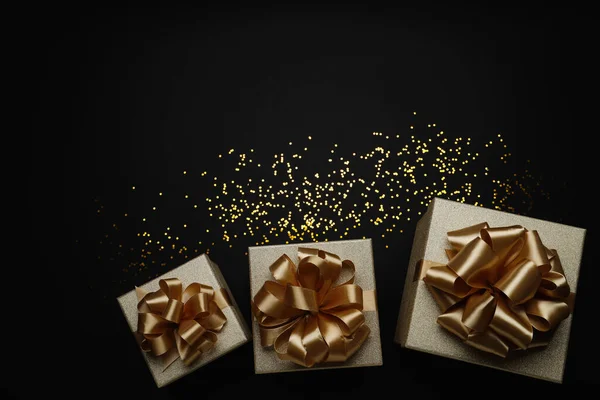 Golden Gift Boxes Confetti Black Background Flat Lay Space Text — Φωτογραφία Αρχείου