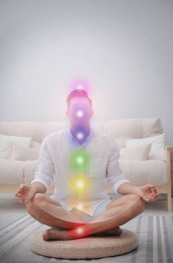 Man meditating on wicker mat at home. Scheme of seven chakras, illustration