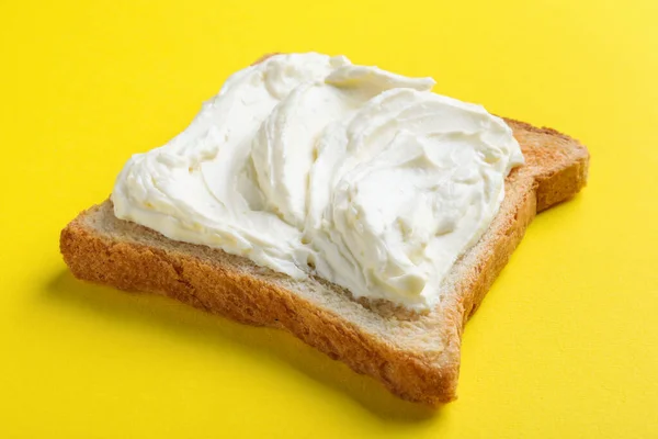 Slice Bread Tasty Cream Cheese Yellow Background Closeup — Fotografie, imagine de stoc