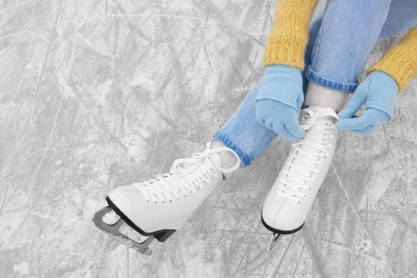 Woman Lacing Figure Skates Ice Top View Space Text — Stockfoto
