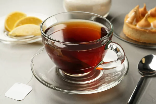 Tea Bag Glass Cup Hot Water Grey Table — Stock Photo, Image