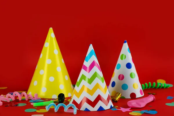 Colorful Party Hats Other Festive Items Red Background — Stock Photo, Image