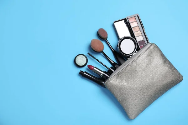 Cosmetic Bag Makeup Products Accessories Light Blue Background Flat Lay — Foto Stock