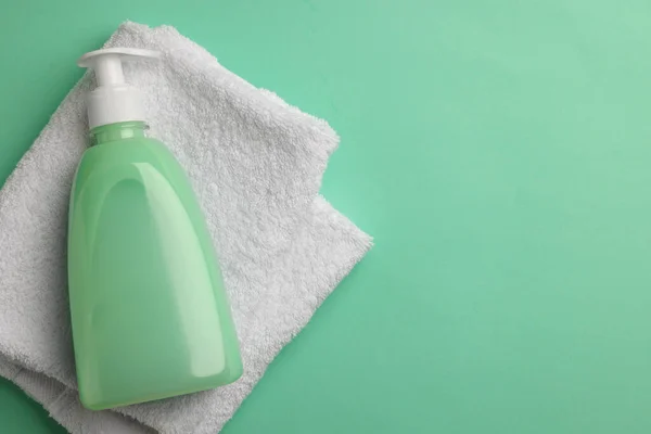 Bottle Liquid Soap Towel Turquoise Background Top View Space Text — Stockfoto