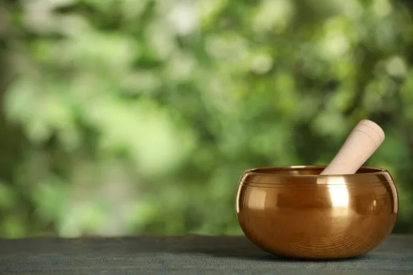 Golden Singing Bowl Mallet Blue Wooden Table Outdoors Space Text — Stockfoto