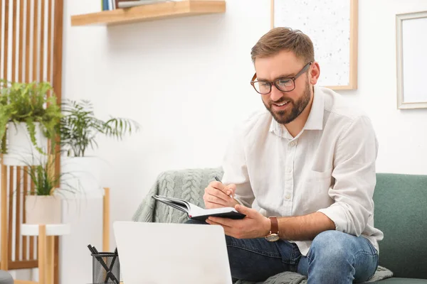 Young Man Working Notebook Laptop Home Space Text — Stok fotoğraf