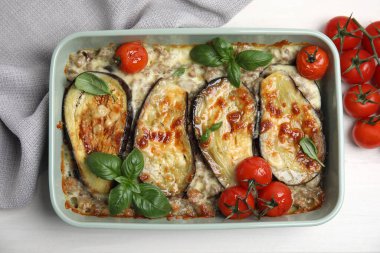 Delicious eggplant lasagna in baking dish on white wooden table, top view