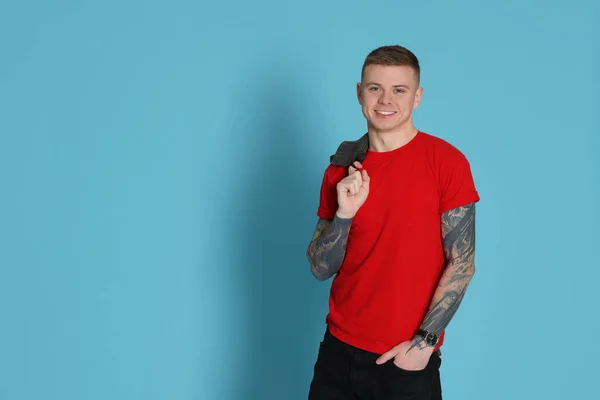 Smiling Young Man Tattoos Light Blue Background Space Text — Stock Photo, Image