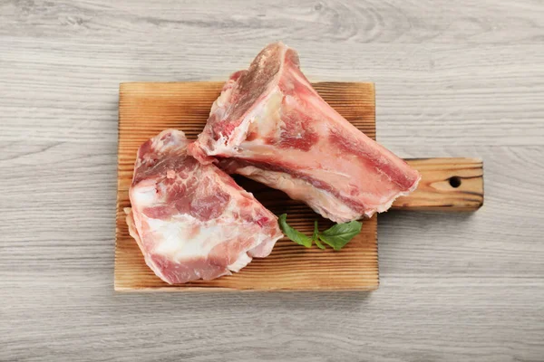 Cutting Board Raw Chopped Meaty Bones Basil Wooden Table Top — Fotografia de Stock
