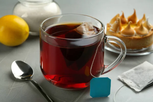 Tea Bag Glass Cup Hot Water Grey Table — ストック写真
