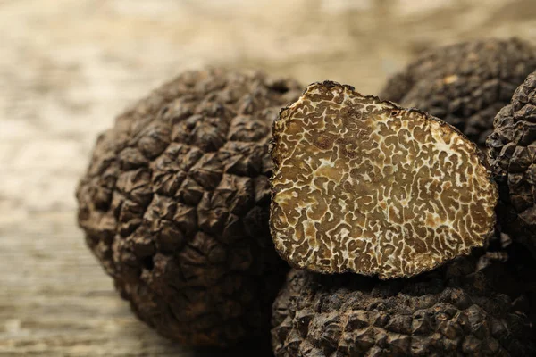 Heap Whole Cut Black Truffles Table Closeup — Fotografia de Stock