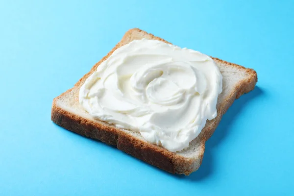 Slice Bread Tasty Cream Cheese Light Blue Background Closeup — Φωτογραφία Αρχείου