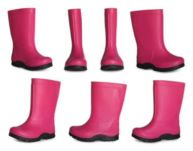 Beyaz arka planda pembe lastik çizmelerle ayarlandı 