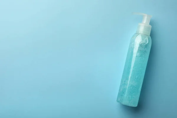 Bottle Cosmetic Gel Light Blue Background Top View Space Text — Stock Photo, Image