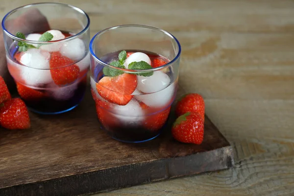 Delicious Cocktails Strawberries Mint Ice Balls Wooden Table — Fotografia de Stock