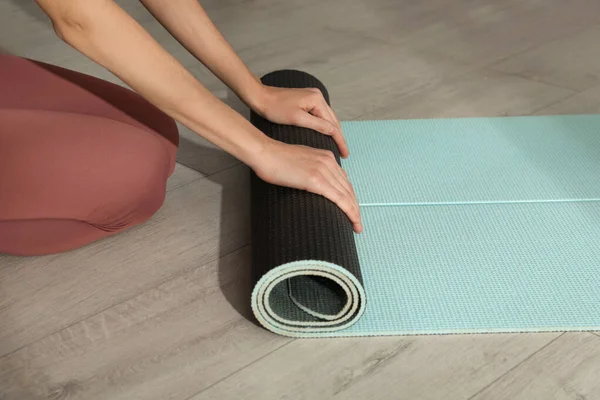 Woman Rolling Yoga Mat Floor Closeup — Stock Photo, Image