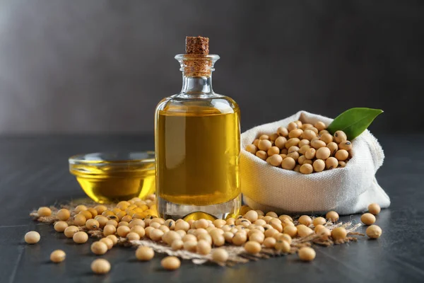 Composition with soybean oil on grey table