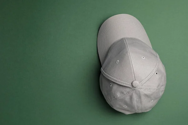 Stylish Grey Baseball Cap Dark Green Background Top View Space — Stock Photo, Image