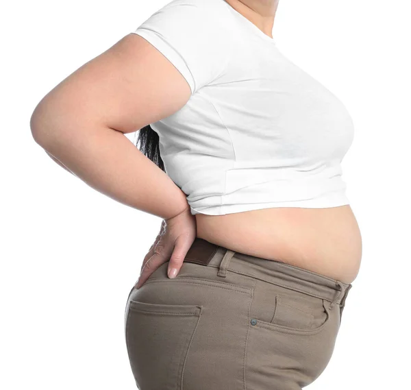 白い背景にタイトなTシャツとズボンで太りすぎの女性 クローズアップ — ストック写真